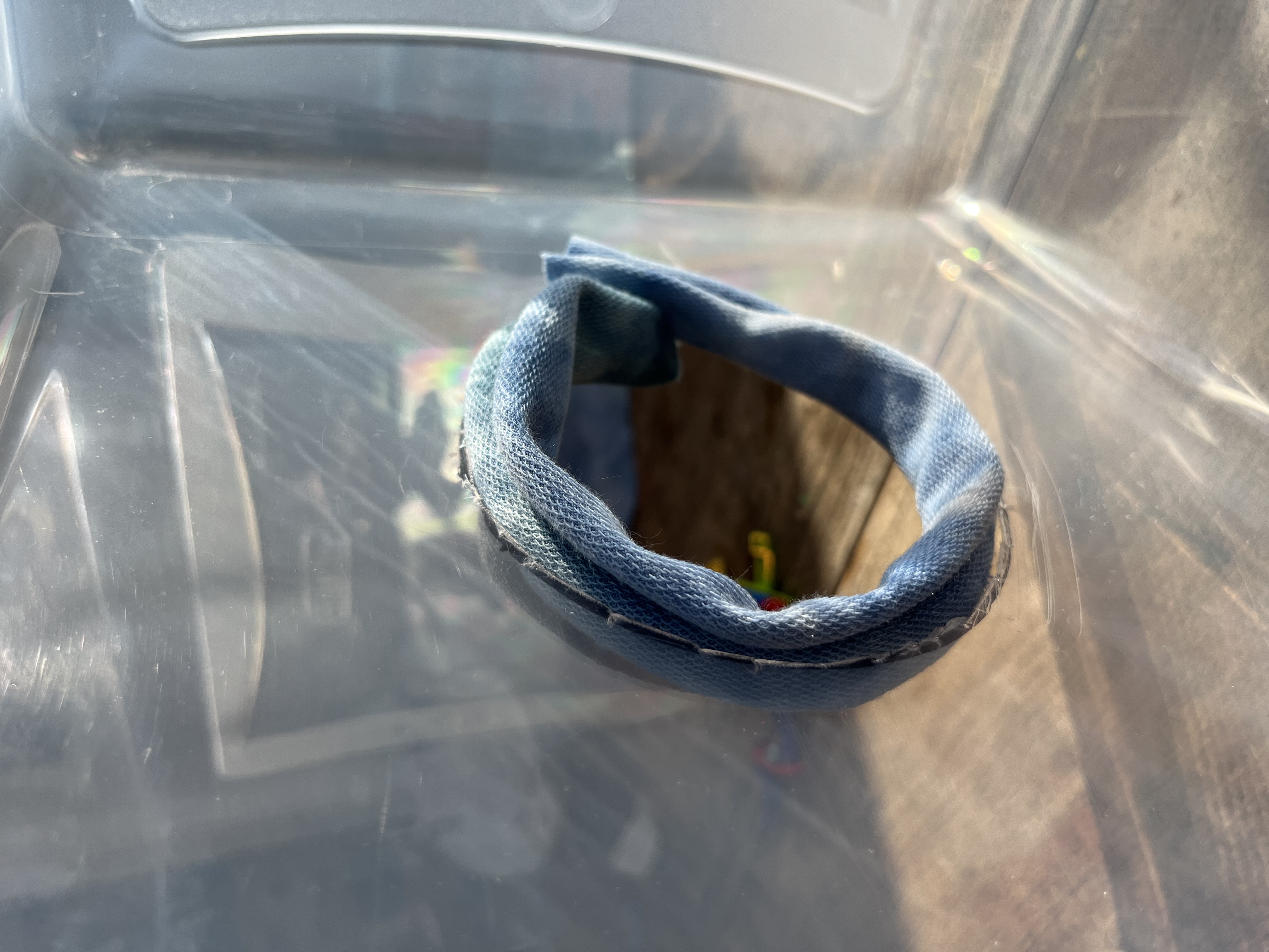 Gluing the fabric sleeve to the hole