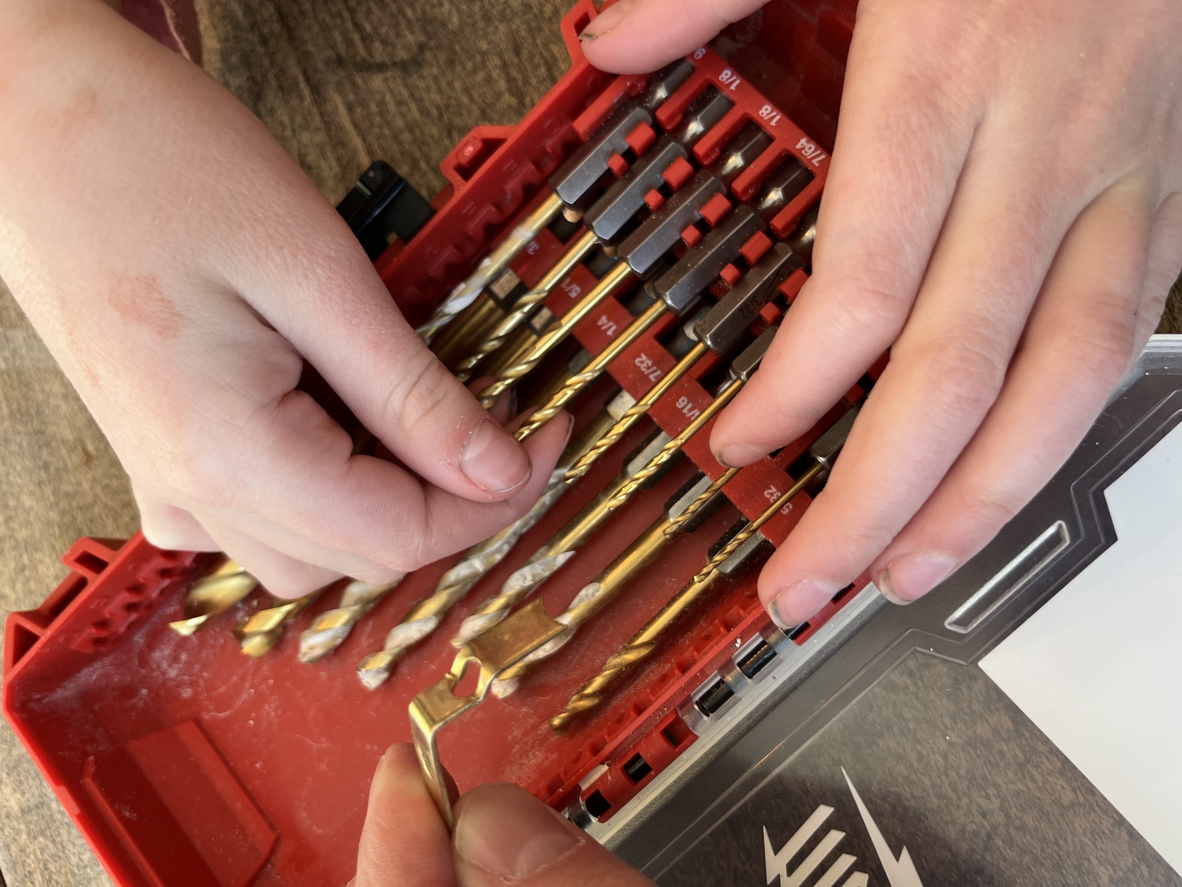Drilling a hole in the blue cup