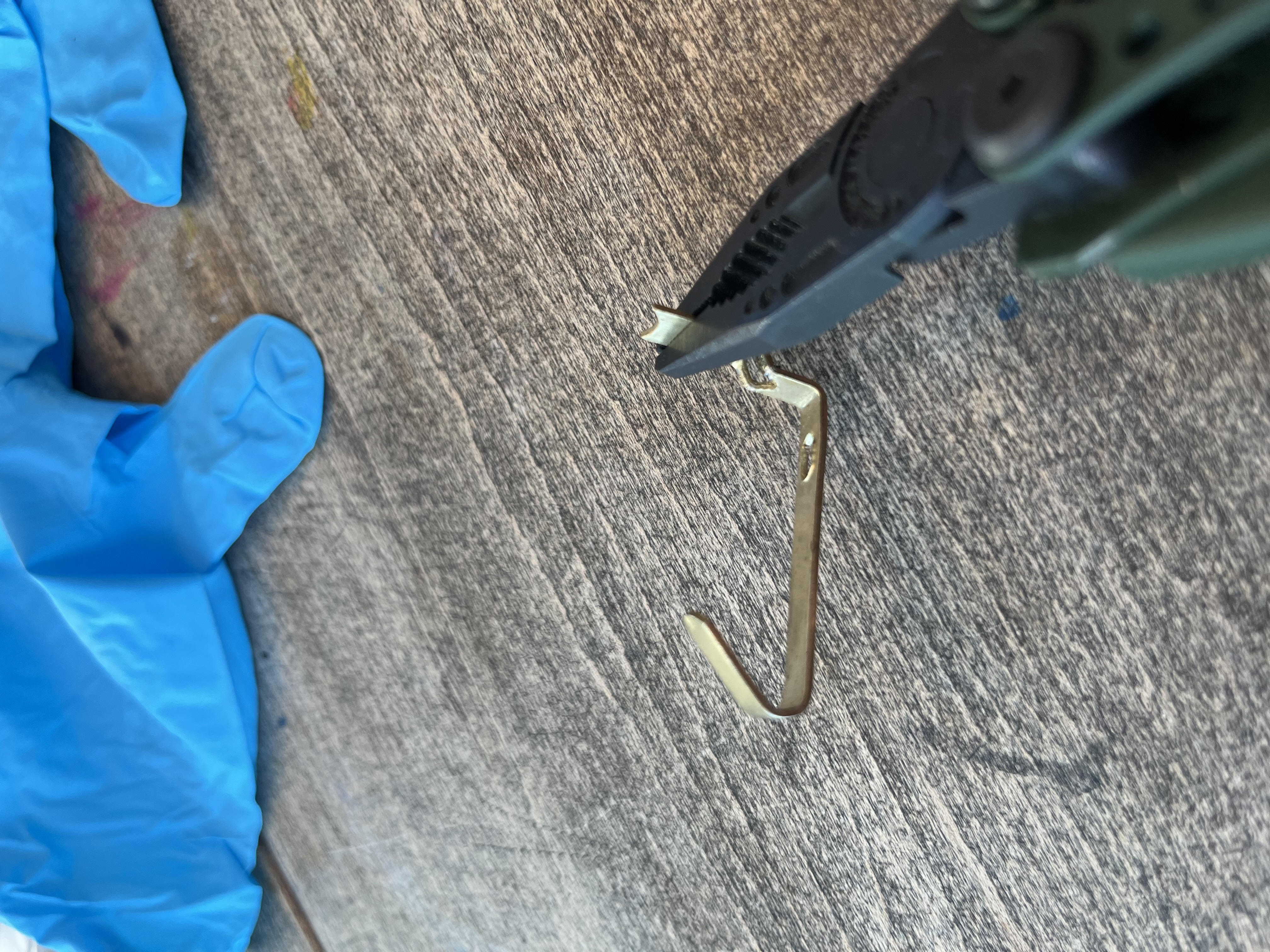 Dad flattening the hook with pliers